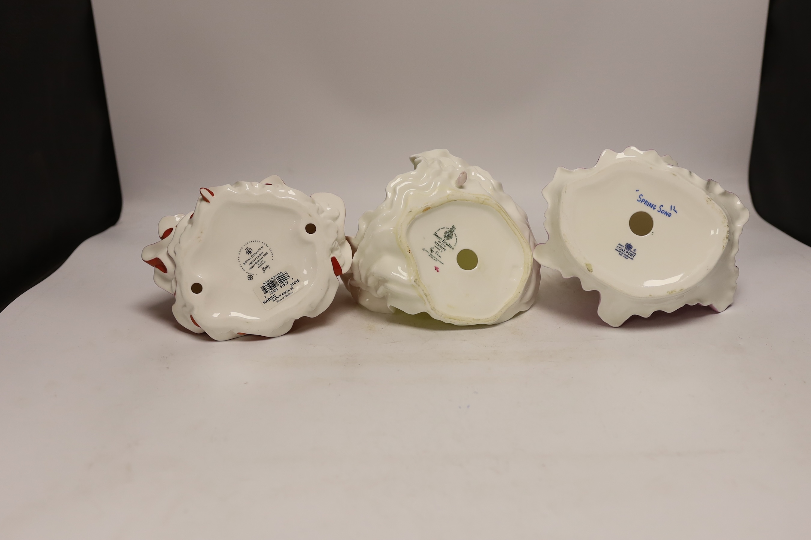 Three Coalport figurines and two Royal Doulton similar figurines